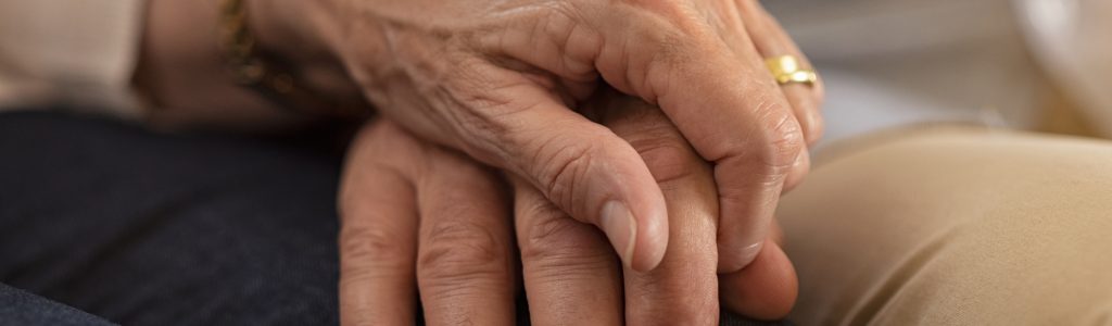 Closeup of senior couple holding hands - Full Circuit Electrical